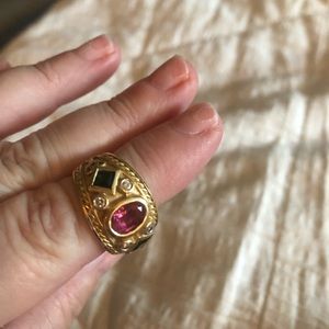 Yellow gold band ring with pink/green tourmaline